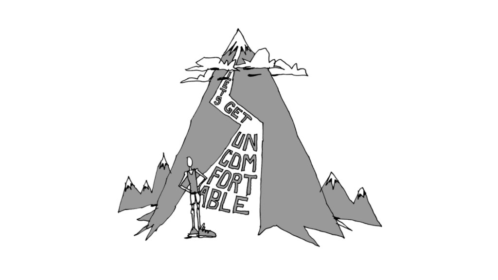 runner standing at mountain base