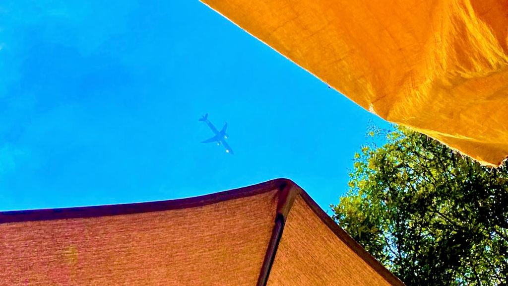 Looking up at a plane over Mexico City.